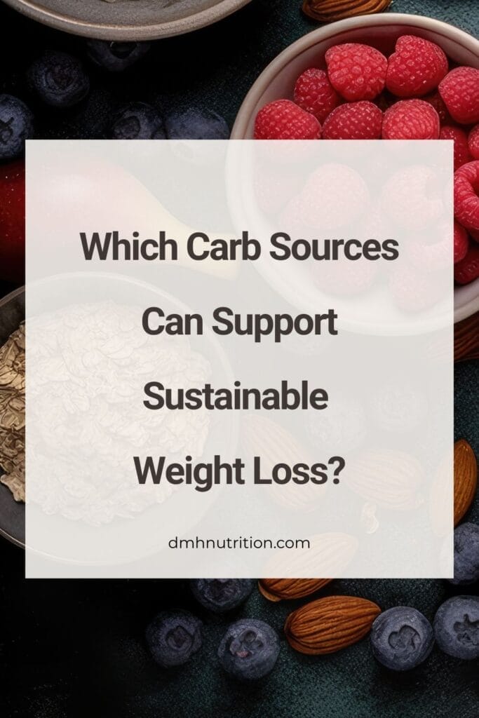 Pinterest pin titled "which carb sources can support sustainable weight loss" with background photo of a white colored bowl of raspberries and a gray colored bowl with uncooked oats surrounded by multiple individual blueberries and almonds on a dark surface.
